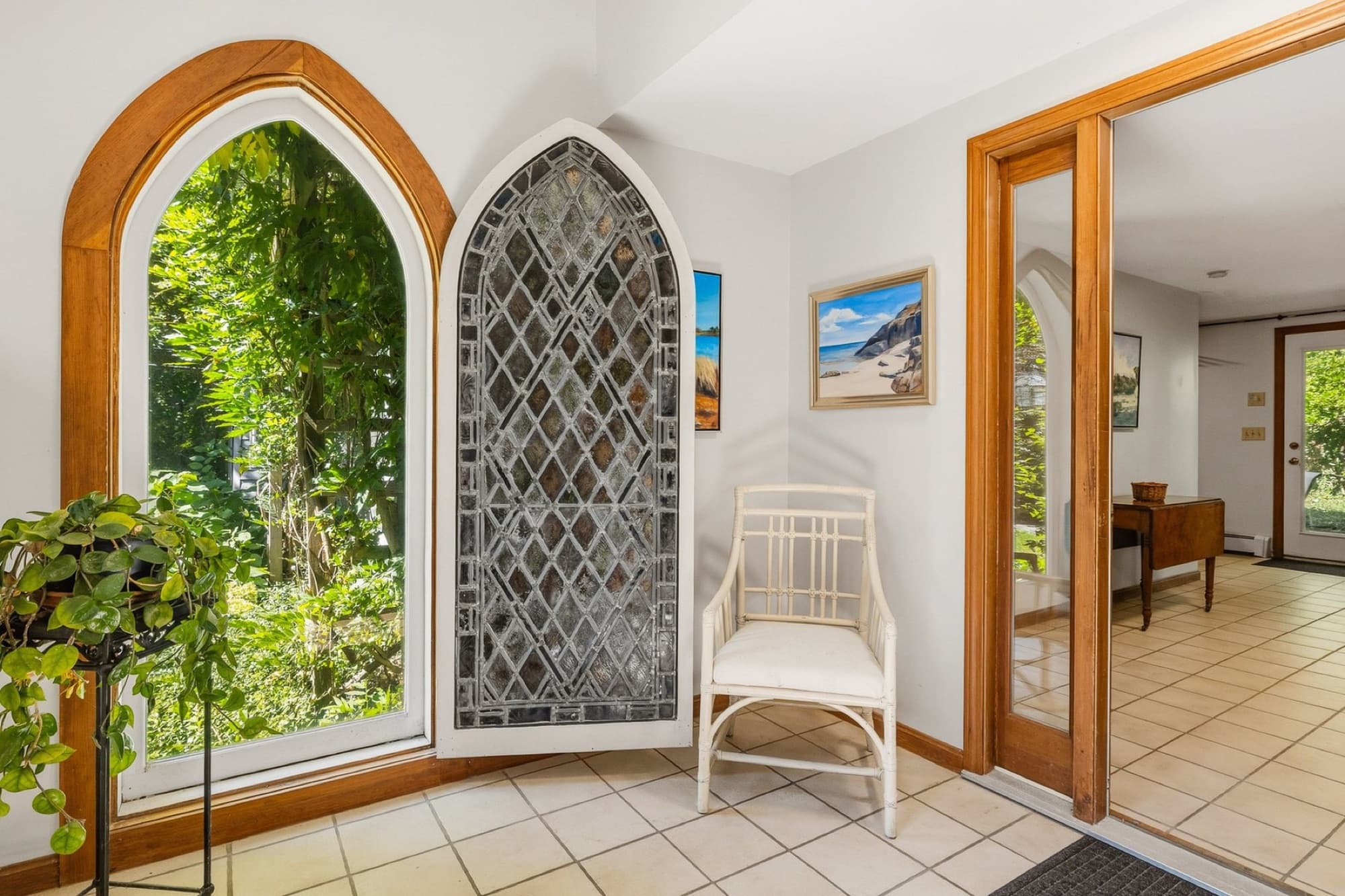 The Gothic windows in the entry, with the door open to the hall beyond